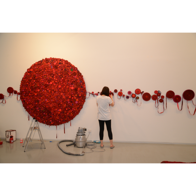 "I later recreated the residue and rolled them into tiny rosettes, cut and sliced them like onions, and reattached them onto the canvas. This is a process of construction, deconstruction, and reconstruction."